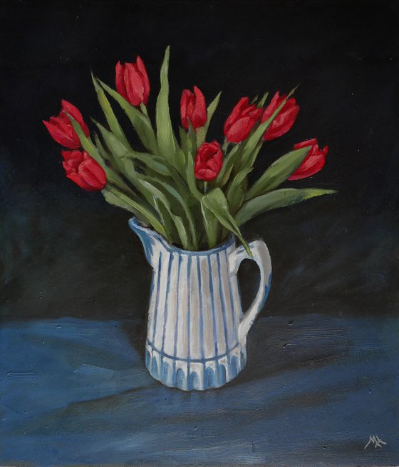 Tulips in blue and white jug