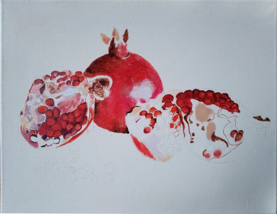 Pomegranate fruit on gold