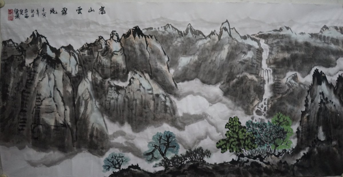 Mountains surrounded by clouds and fog by Jenny Sze