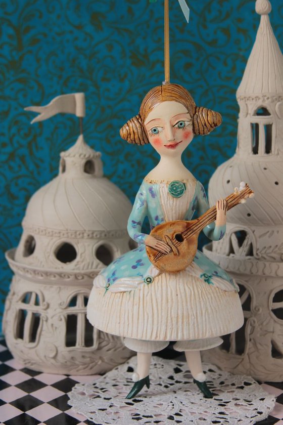 Girl with a mandoli. Ceramic hanging sculpture