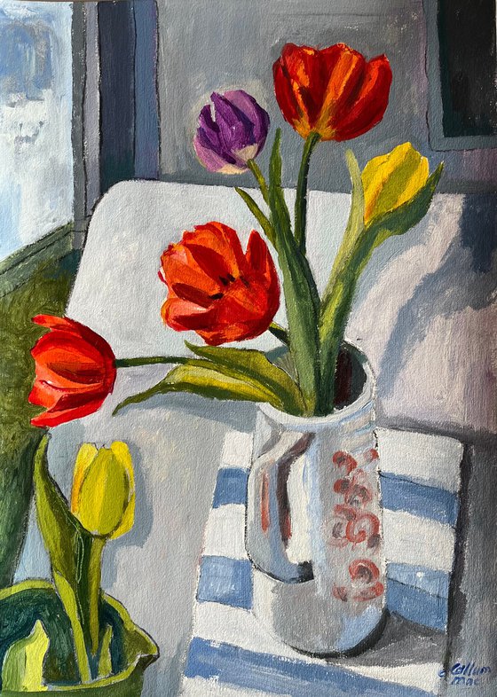 Tulips in a blue jug