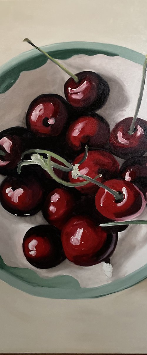 cherries in diner crockery by Donn Poll