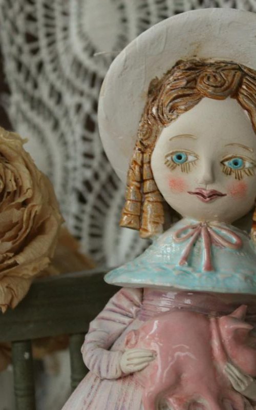 Vintage dressed girl holding a pig. Mini sculpture, unique ceramic bell doll. by Elya Yalonetski