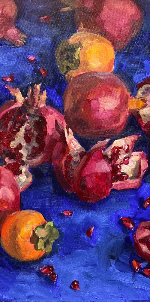 Pomegranates and persimmons on blue by Nataliia Nosyk