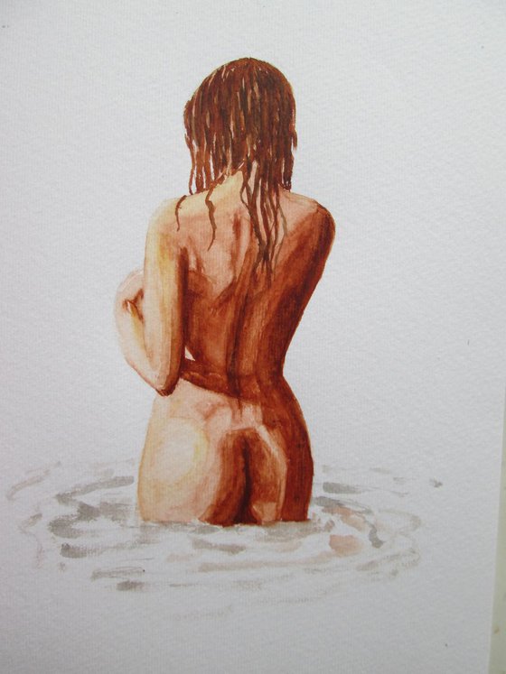 Nude standing in water