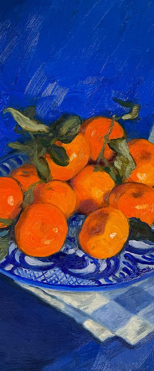 Tangerines on a plate by Elina Arbidane