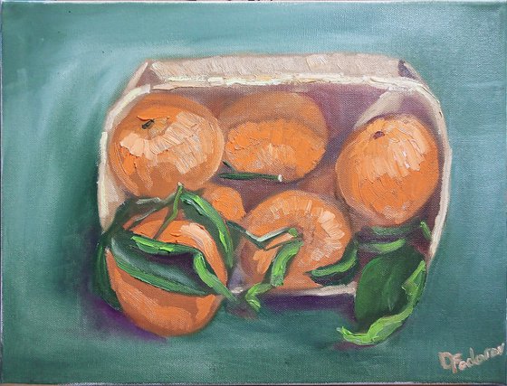 Still life with tangerines in a wooden basket