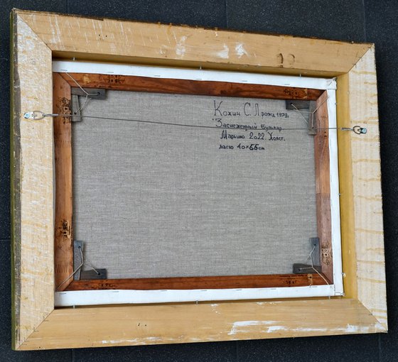 Snow-covered boulevard in Maryino