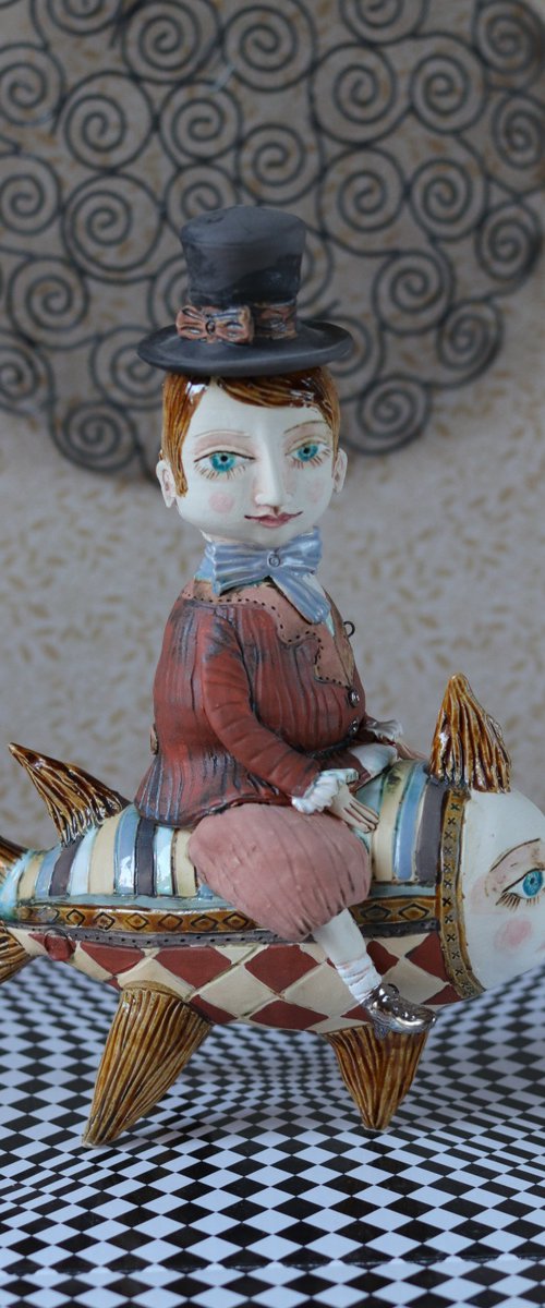 Vintage dressed boy riding the fish. From "Le Carousel, Hommage à l'Innocence" project by Elya Yalonetski by Elya Yalonetski