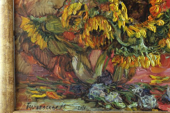 Sunflowers on a red drapery