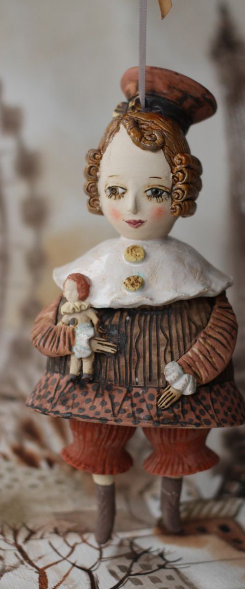 Vintage girl with a doll. From "Le Carousel, Hommage à l'Innocence" project by Elya Yalonetski by Elya Yalonetski