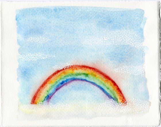 Watercolor rainbow in blue sky