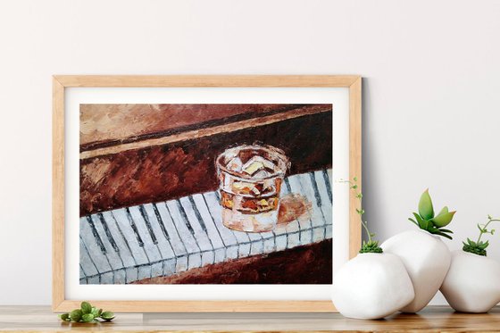 Glass of whiskey on the piano
