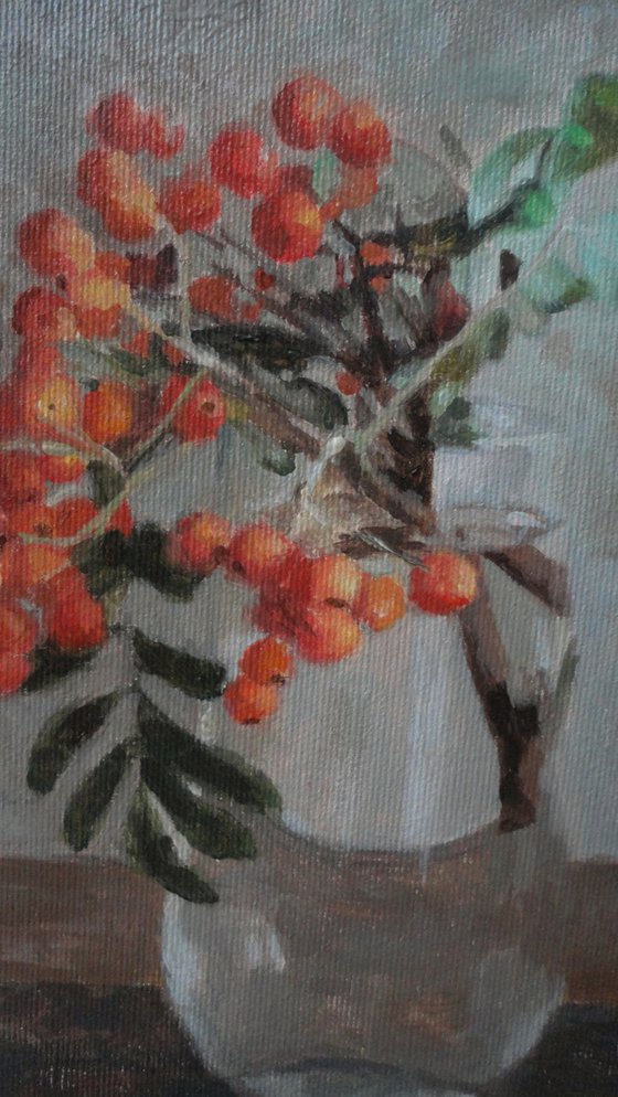 Red fruits in a vase