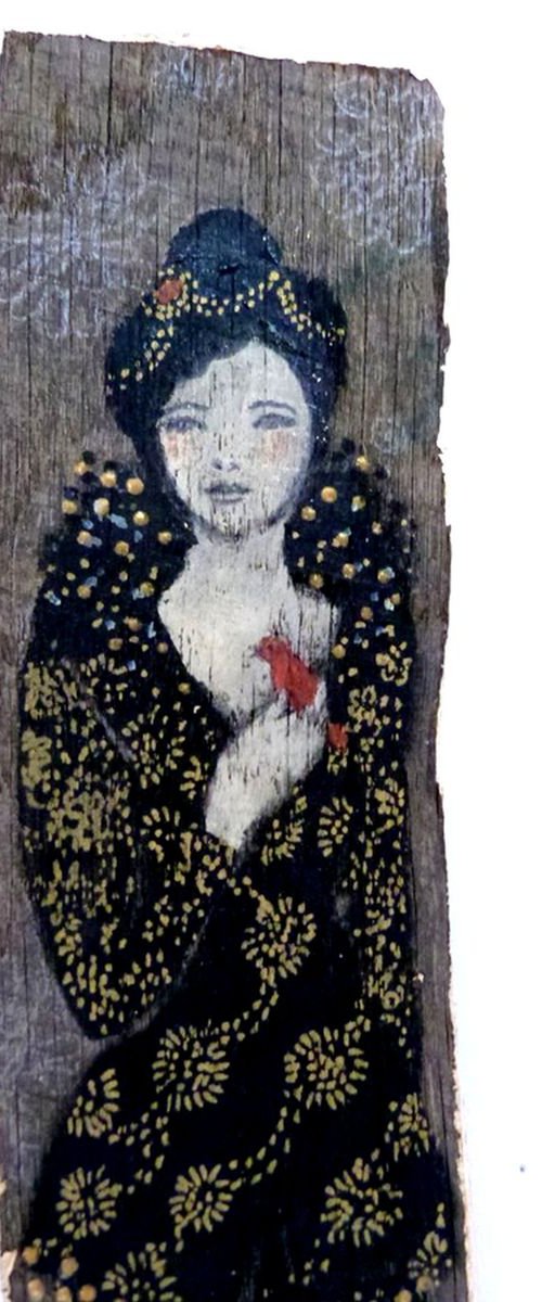 Painted wood, woman with a red bird. by Loetitia Pillault