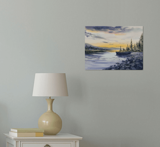 A lonely boat at sunset