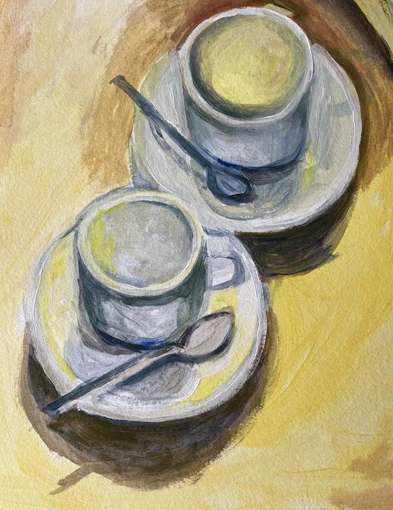 Banana and two espresso cups