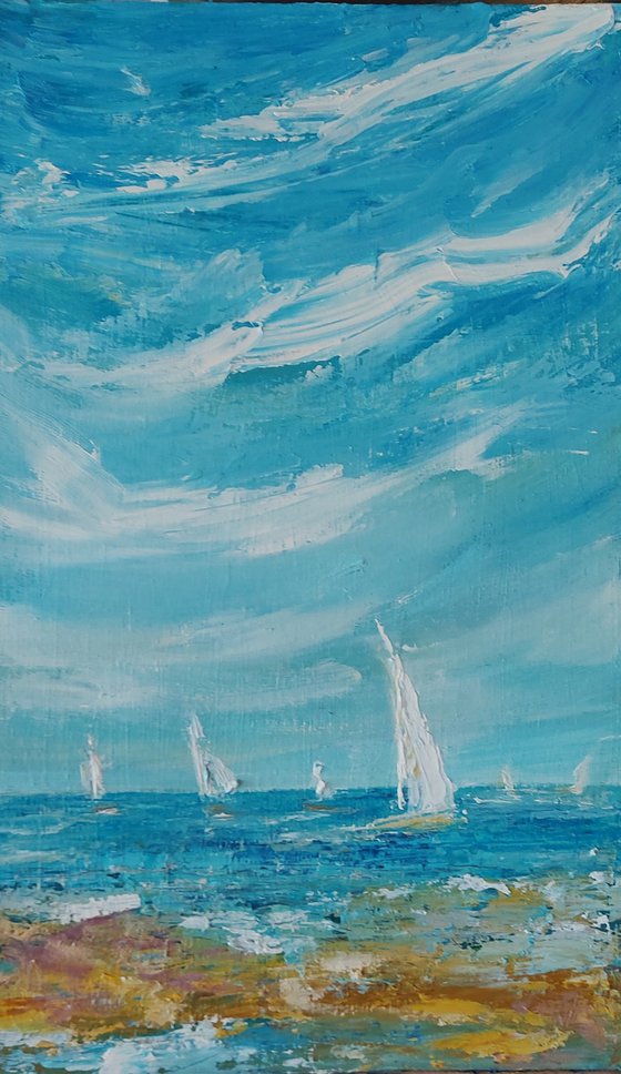 White sails on a blue day