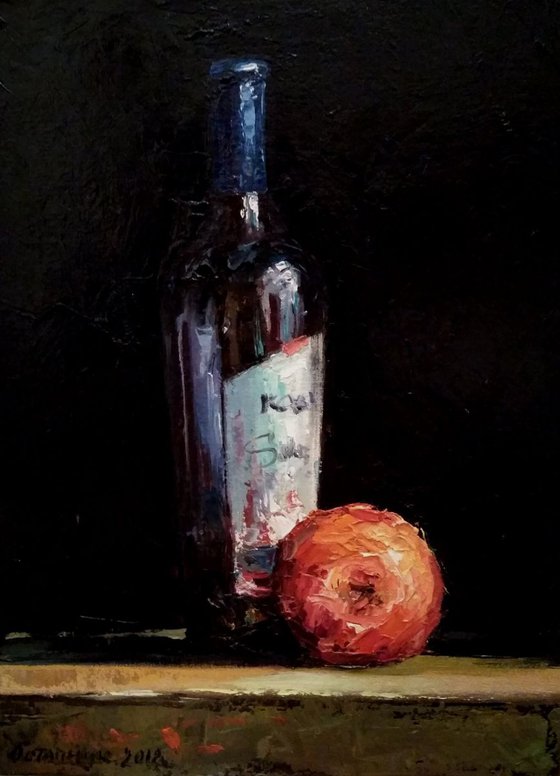 Still life with a bottle of wine and an apple.