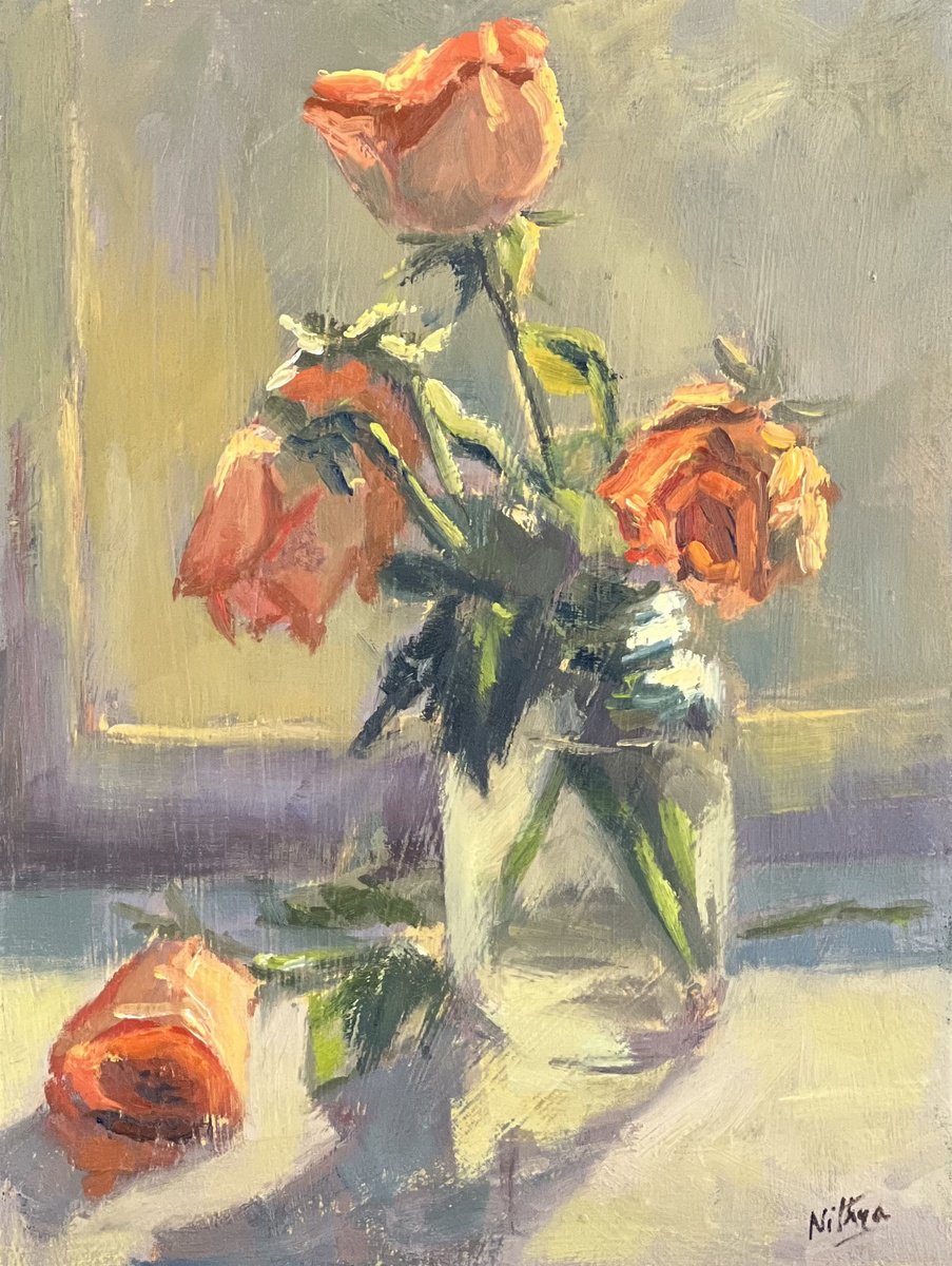Orange roses in the evening light by Nithya Swaminathan