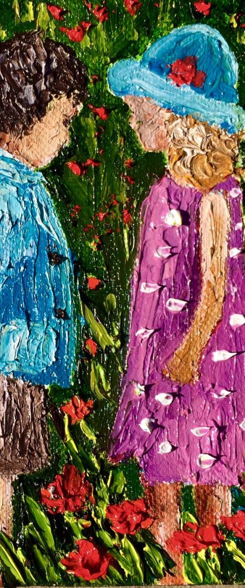 Boy and a girl on the flowers field by Inna Montano