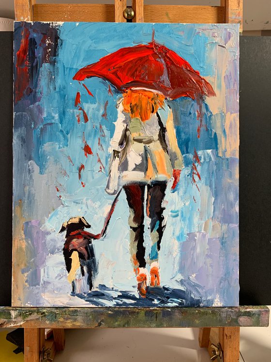 Woman with umbrella and dog.