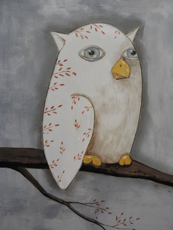 The freaky white owl on the branch