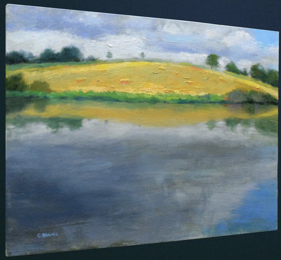 Hay Bale Field across the Reservoir, England