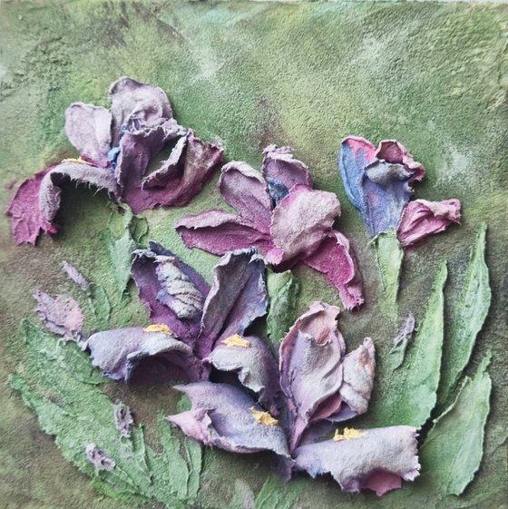 Miniature purple irises. A small floral botanical relief. 3d painting of spring flowers with ceramic petals.