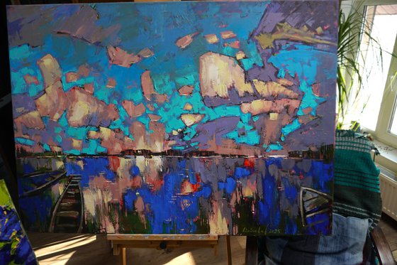 Mirror of water, boats in the clouds