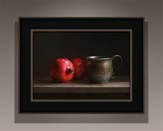 Pomegranates with a cup