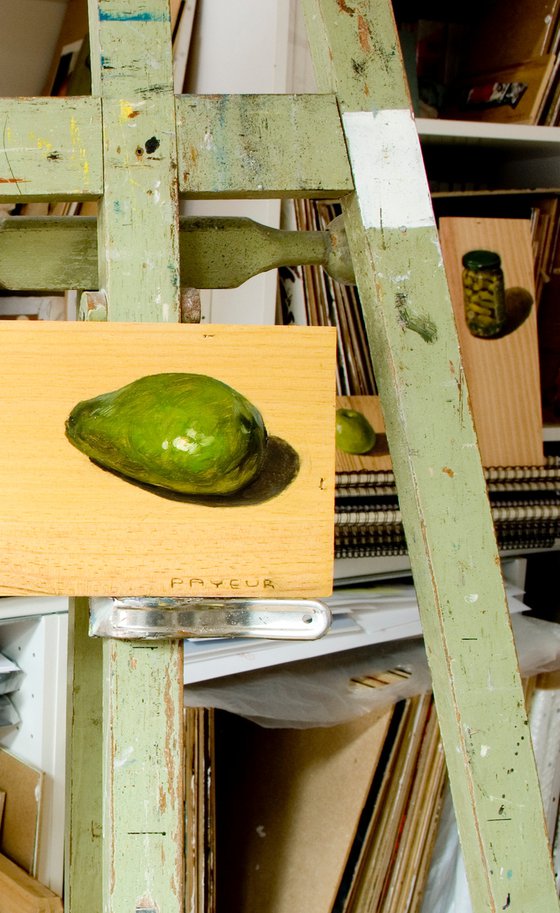 green avocado on a wood board for food lovers