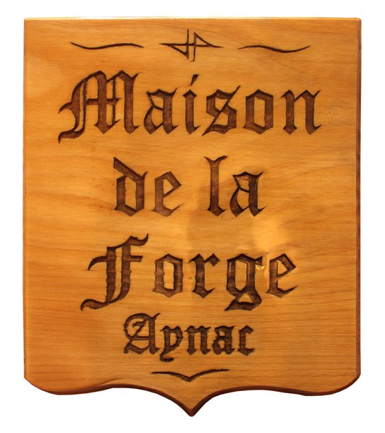carved panel: House of the forge Aynac