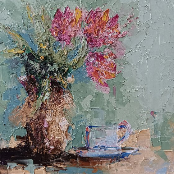 Coffee and tulips on the table