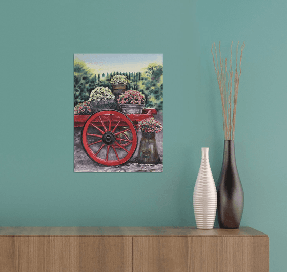 Old red cart with flowers