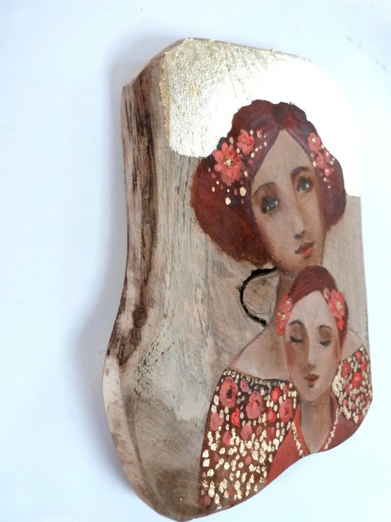 Mother and daughter, portrait on wood, piece of teak. Pink osmosis.