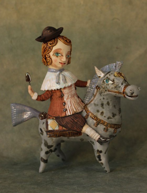 Vintage dressed boy riding the horse. From "Le Carousel, Hommage à l'Innocence" project by Elya Yalonetski