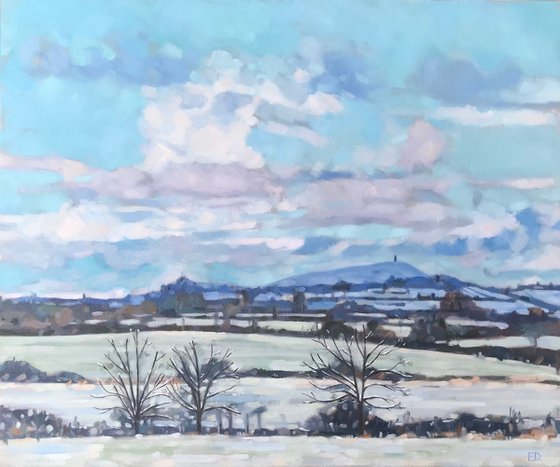 Snowy Skies Over Glastonbury Tor