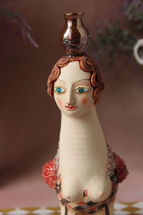 Bird Women with a jug. Ceramic sculpture