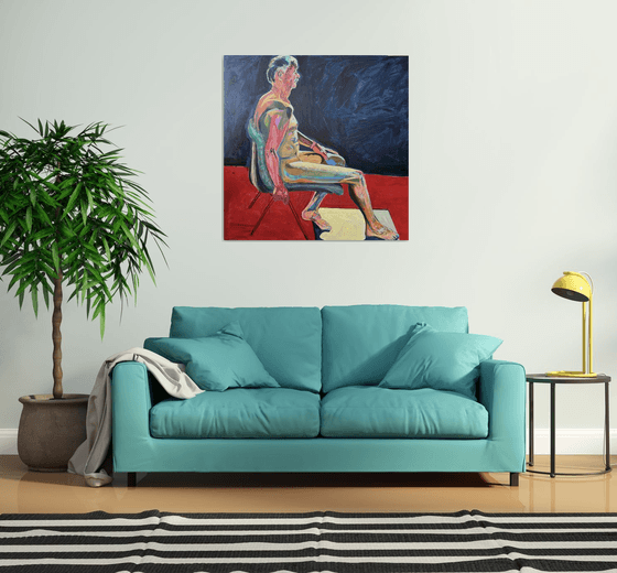 Seated Chap in dark blue room