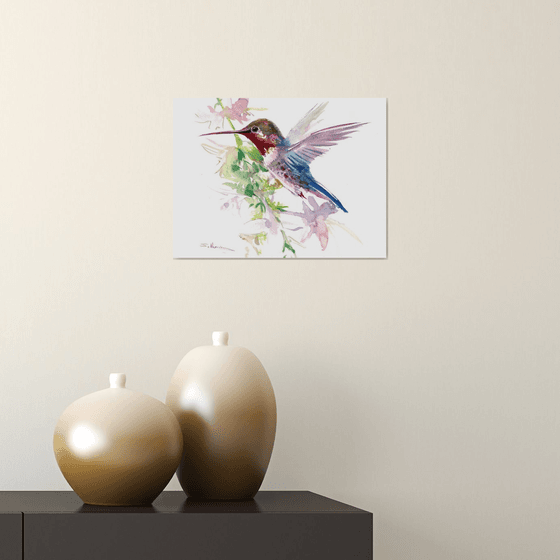 Flying Hummibgbird and flowers