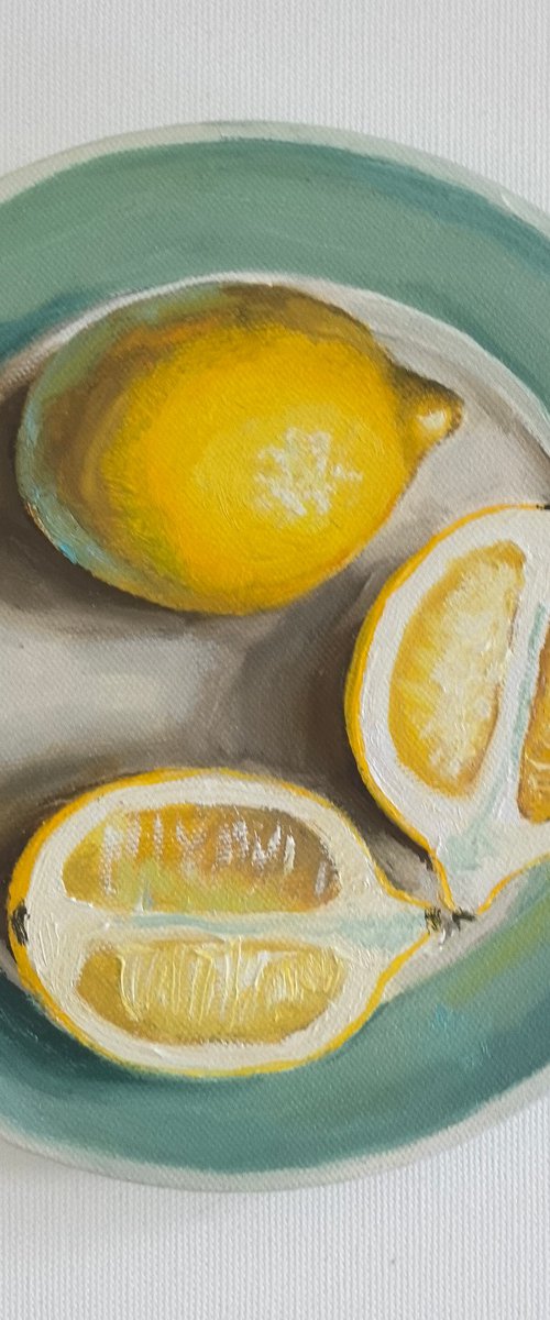 Lemons on plate by Leyla Demir