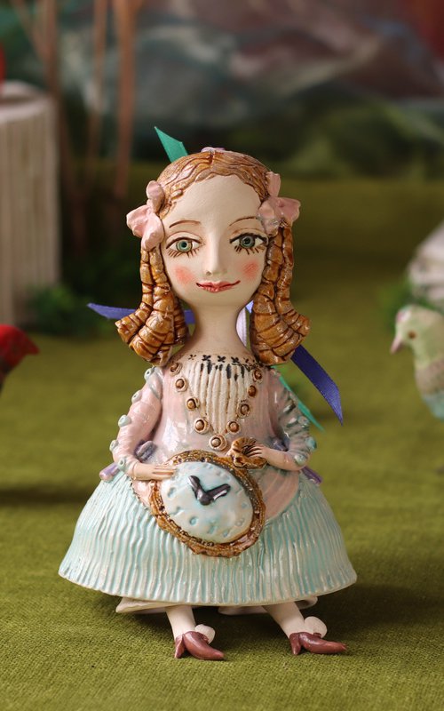 Little Girl with a clock. Hanging sculpture, bell doll by Elya Yalonetski by Elya Yalonetski