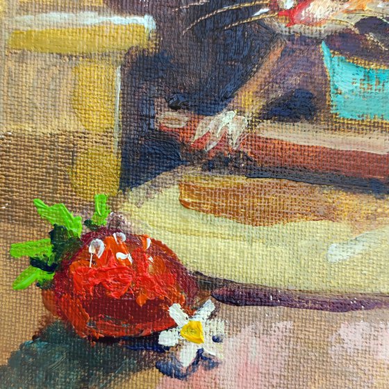 The mouse is baking a strawberry pie