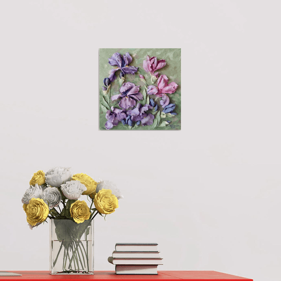 Fragile purple irises in the wind are delicate and elegant. A small floral botanical relief. 3d painting of spring flowers with ceramic petals.