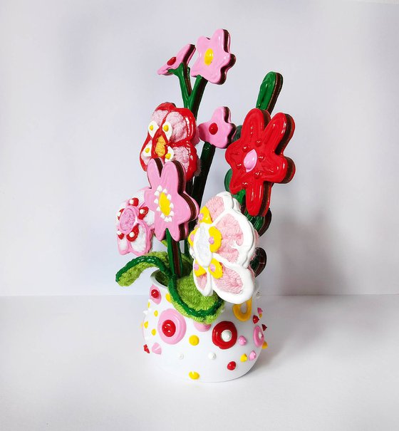 Knitted flowers in vase