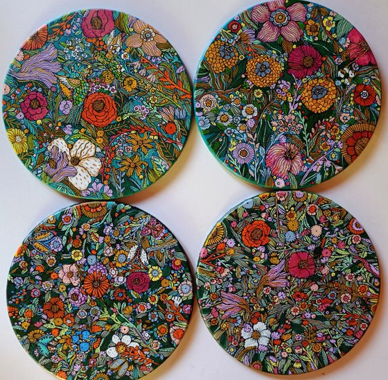 quadriptych of flowers on dark