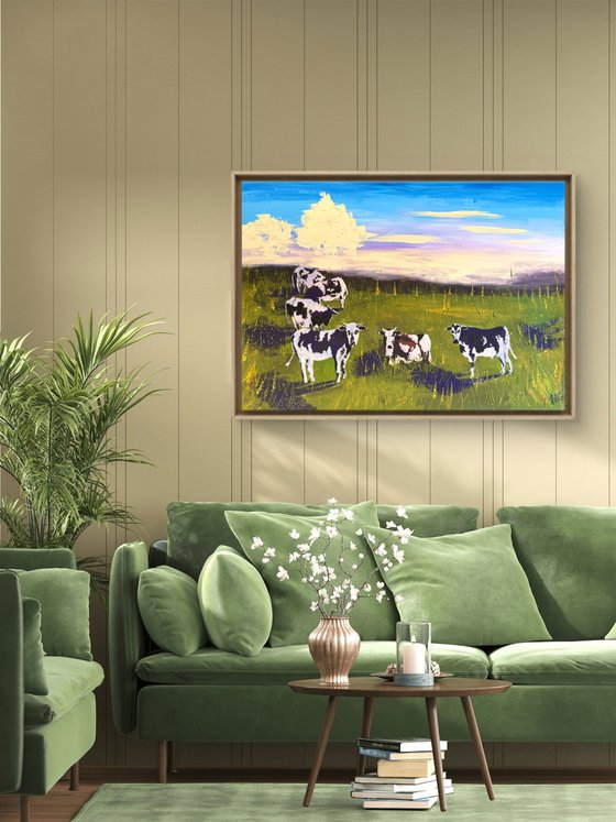Cows grazing in the field