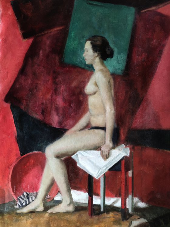 A nude on the chair.
