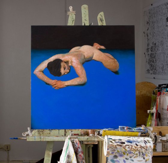 modern nude woman on deep blue background